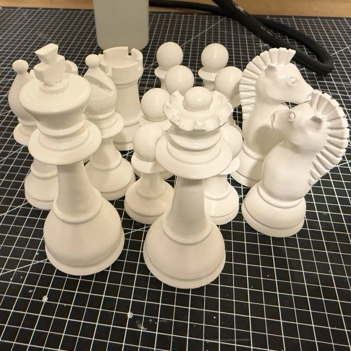 3D printed white chess pieces